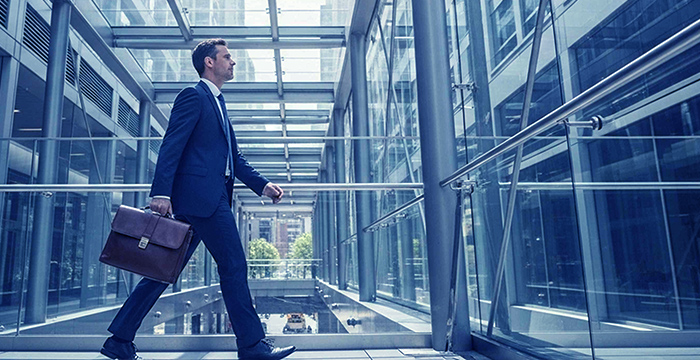 Advisor walking through modern office